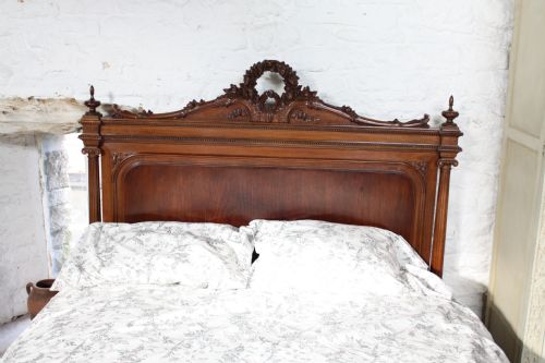 fig 2. Beautifully carved French Louis XV1 style walnut and mahogany king size bed