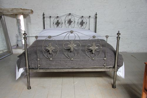 fig 1. Truly stunning burnished iron king size bed with taper tube posts