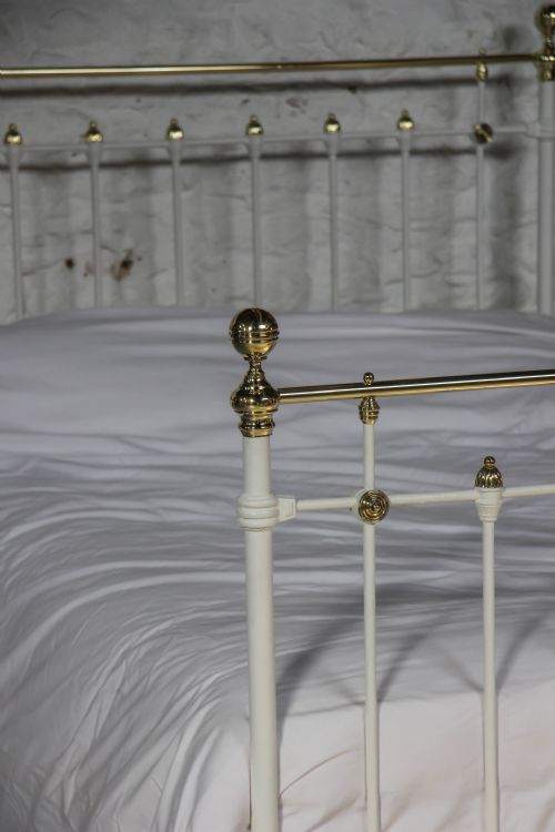 fig 1. Classic Victorian brass and white double bed with spindle detail