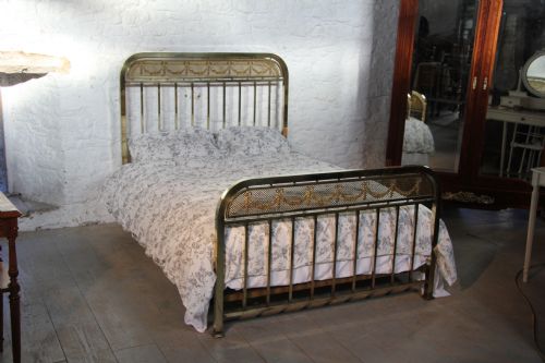 fig 1. IndividualFrench all brass bed with decorative garlands
