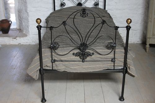 fig 1. Pretty early black and brass single Victorian bed
