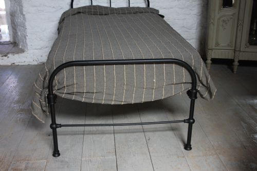 fig 1. Simple iron dormitory style black single bed