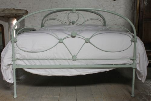 fig 1. Lovely simple iron king size bed finished in blackbird egg paint effect