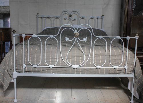 fig 1. Pretty king size Victorian iron bedstead with little brass detail