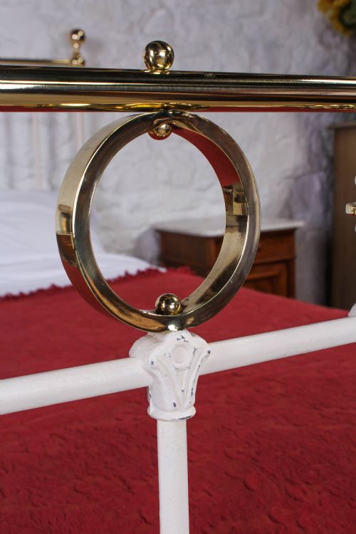 fig 2. Pretty three quarter white and brass bed