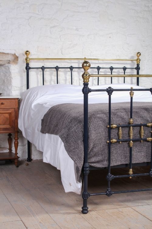 fig 1. Classic Victorian blue and brass king size bed with ring and spindle detail