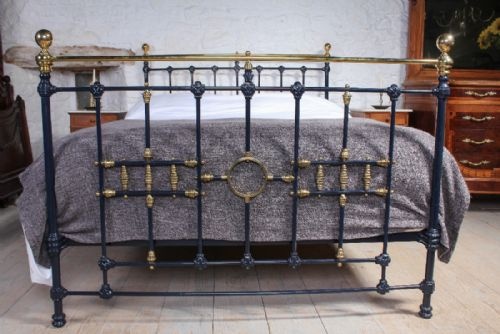 fig 2. Classic Victorian blue and brass king size bed with ring and spindle detail