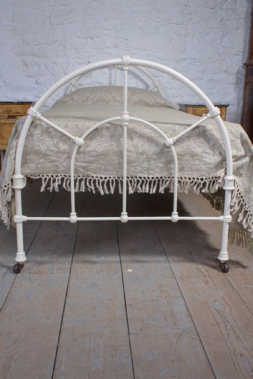 fig 1. Simple single white iron bed