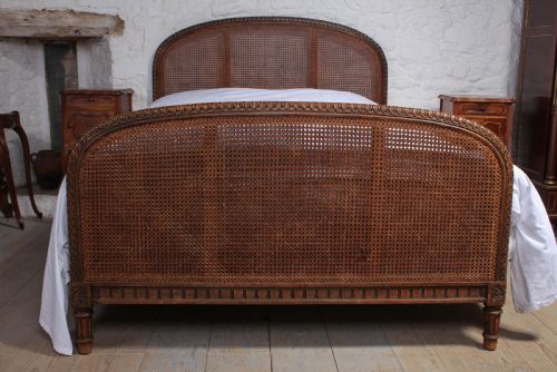 fig 1. French carved and caned bergere king size bed