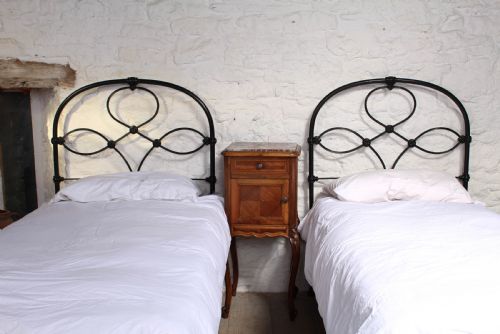 fig 1. Attractive pair of black all iron no end single beds