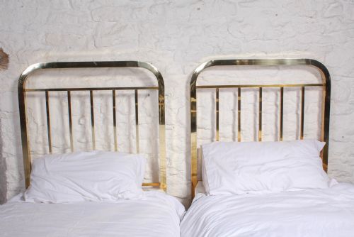 fig 3. Attractive pair of simple French all brass single beds