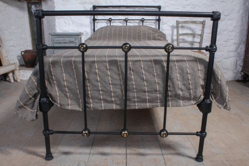 fig 1. Simple black iron single bed