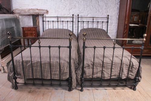 fig 1. Lovely pair of black and aged brass single beds
