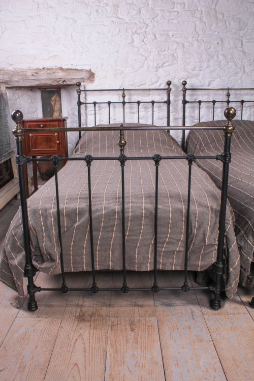 fig 2. Lovely pair of black and aged brass single beds