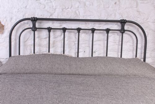 fig 1. Pleasingly simple all iron king size bed