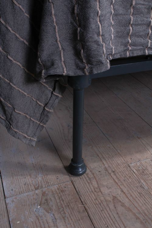fig 1. Pleasingly simple all iron king size no end bed