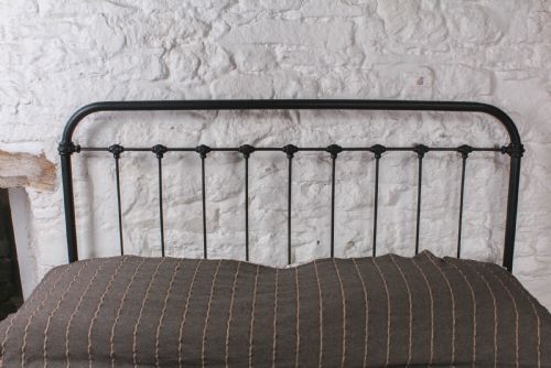 fig 3. Pleasingly simple all iron king size no end bed