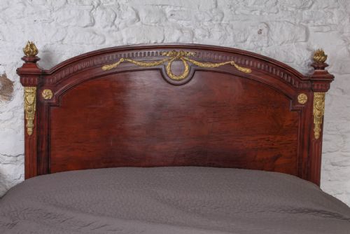 fig 2. Magnificent Louis XV1 style bed with flame mahogany panels