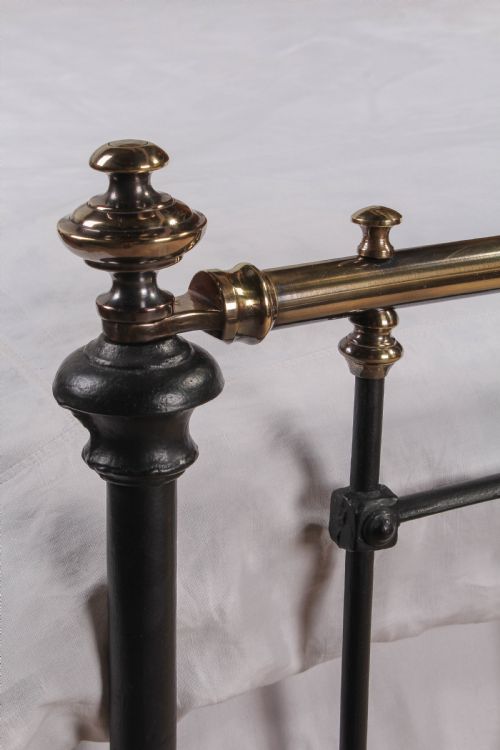 fig 1. Pleasingly simple early Victorian brass and iron king size bed with forged iron panel