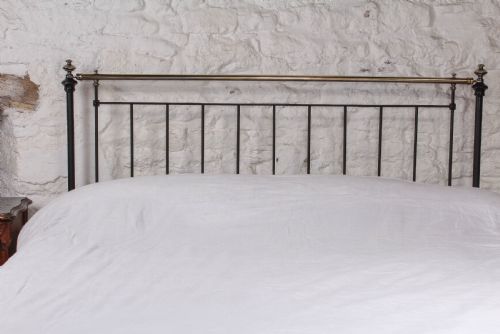 fig 2. Pleasingly simple early Victorian brass and iron king size bed with forged iron panel