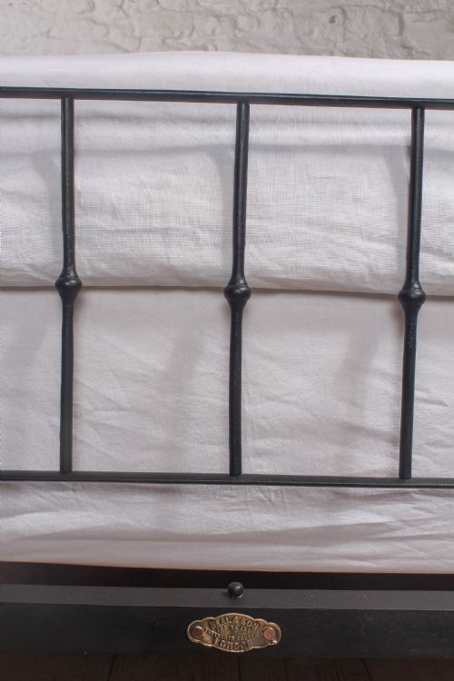 fig 3. Pleasingly simple early Victorian brass and iron king size bed with forged iron panel