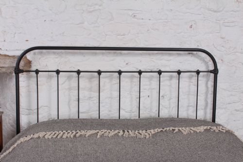 fig 1. Pleasingly simple all iron king size bed