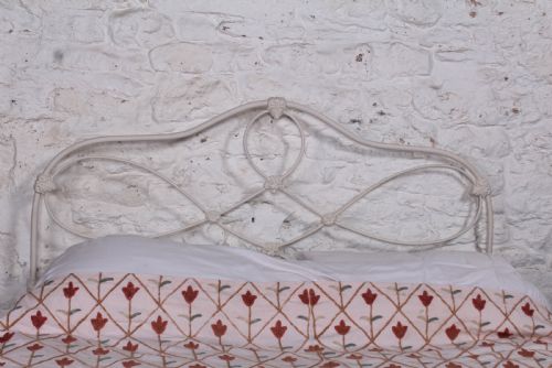 fig 1. Pleasingly shaped all iron Irish king size no end bed