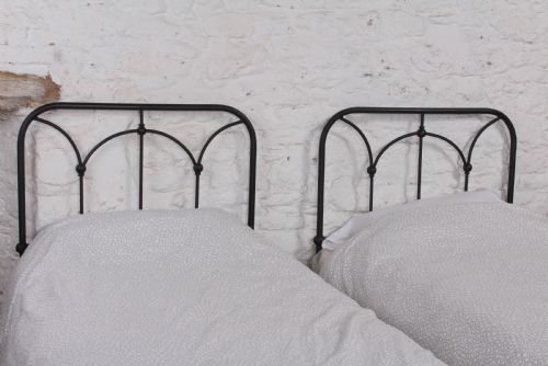 fig 2. Lovely simple pair of all iron single beds