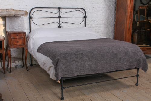 fig 1. Pleasingly simple all iron king size nioend bed