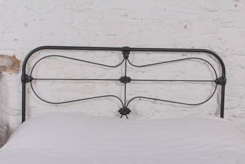 fig 3. Pleasingly simple all iron king size nioend bed