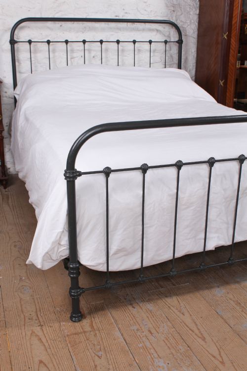 fig 3. Pleasingly simple French all iron king size bed