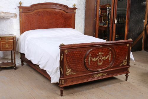 Magnificent Mahogany and Fruit Wood Parquetry King Size Bed with Striking Ormolu Decoration.
