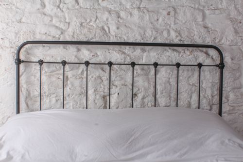 fig 1. Pleasingly simple all iron no end double bed