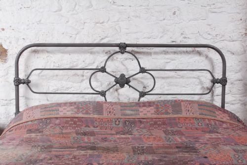 fig 1. Pleasing all iron Irish king size bed