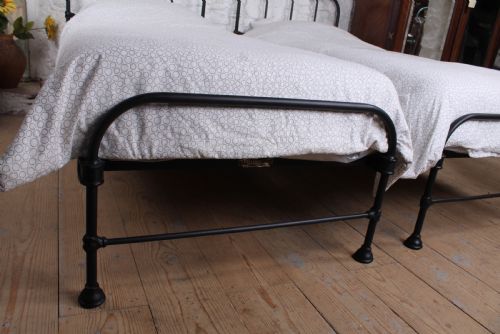fig 3. Lovely simple pair of Staples utilitarian single iron beds (can be joined)