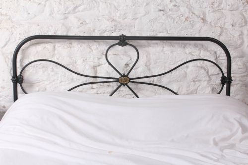fig 3. Charming iron cottage style double bed