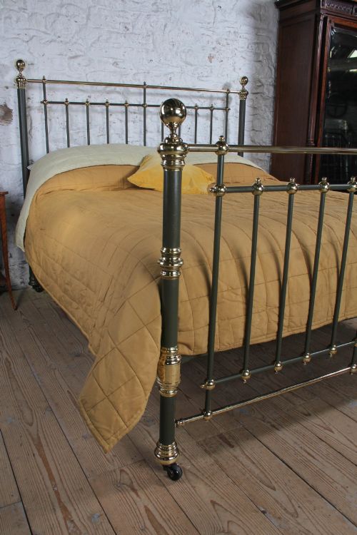 fig 1. Victorian super-king size bedstead featuring dark green painted iron spindles and polished brass rails and finials.