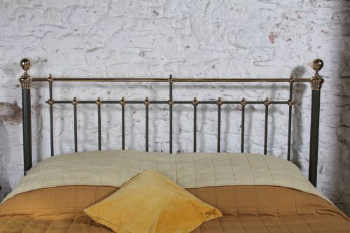 fig 2. Victorian super-king size bedstead featuring dark green painted iron spindles and polished brass rails and finials.