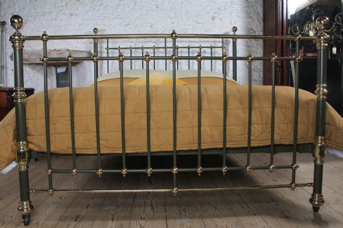 fig 3. Victorian super-king size bedstead featuring dark green painted iron spindles and polished brass rails and finials.