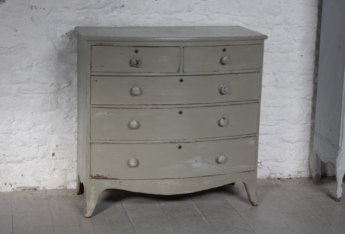 Bow front five drawers chest of drawers painted in aged Little Greene Company cobblestone