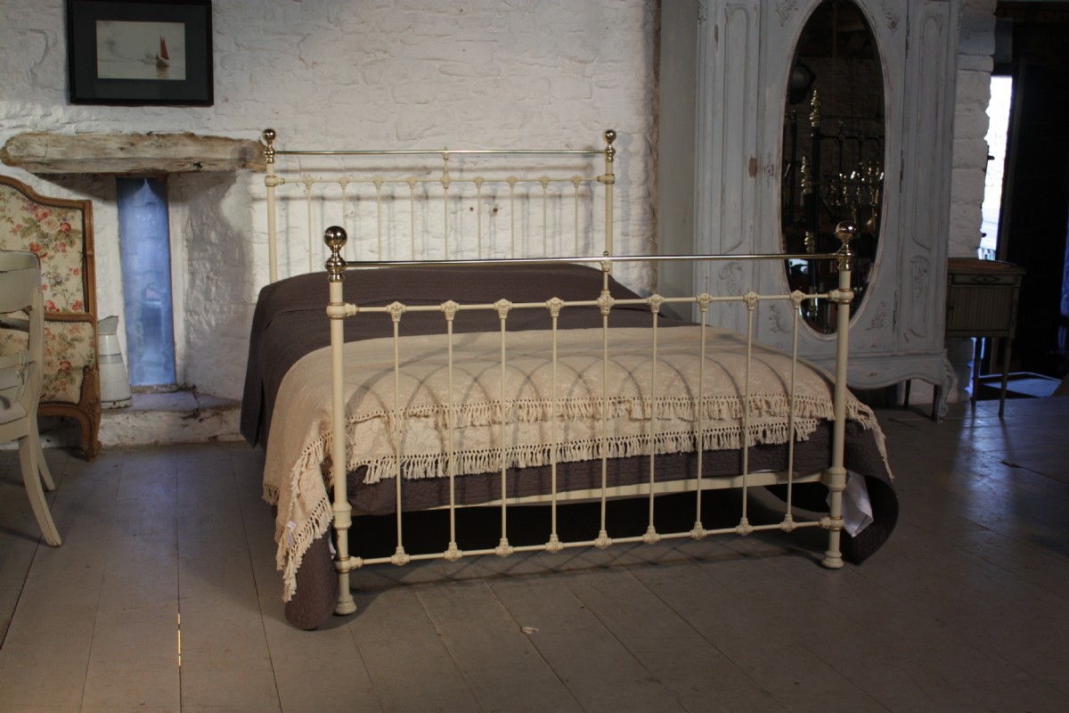 Classic Victorian king size brass and iron  bedstead in aged white and gold