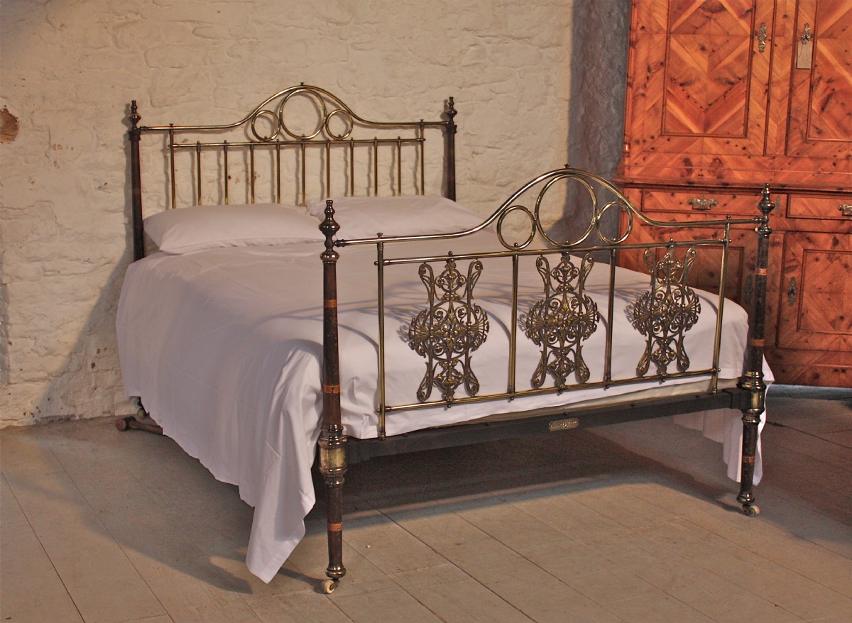 Original paint and transfers taper posts with pierced and engraved decorative panels kingsize Victorian bed