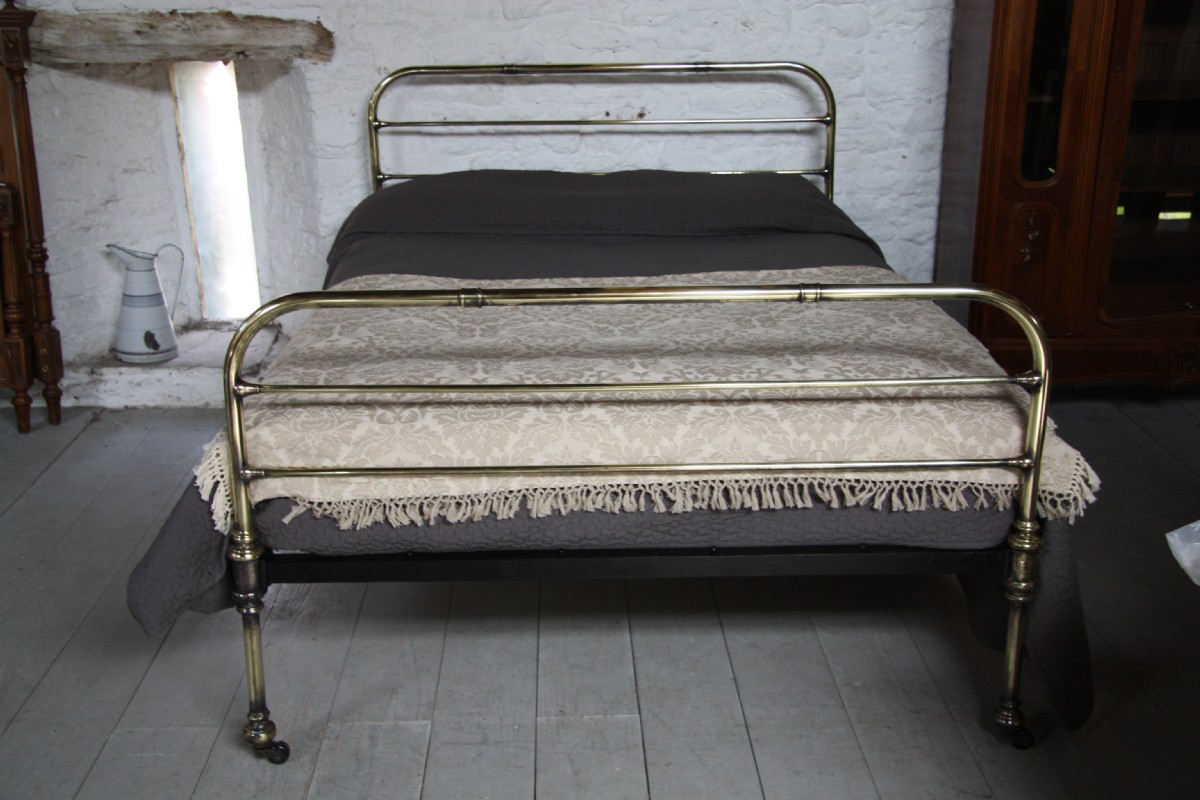 Simple Victorian kingsize aged brass bedstead