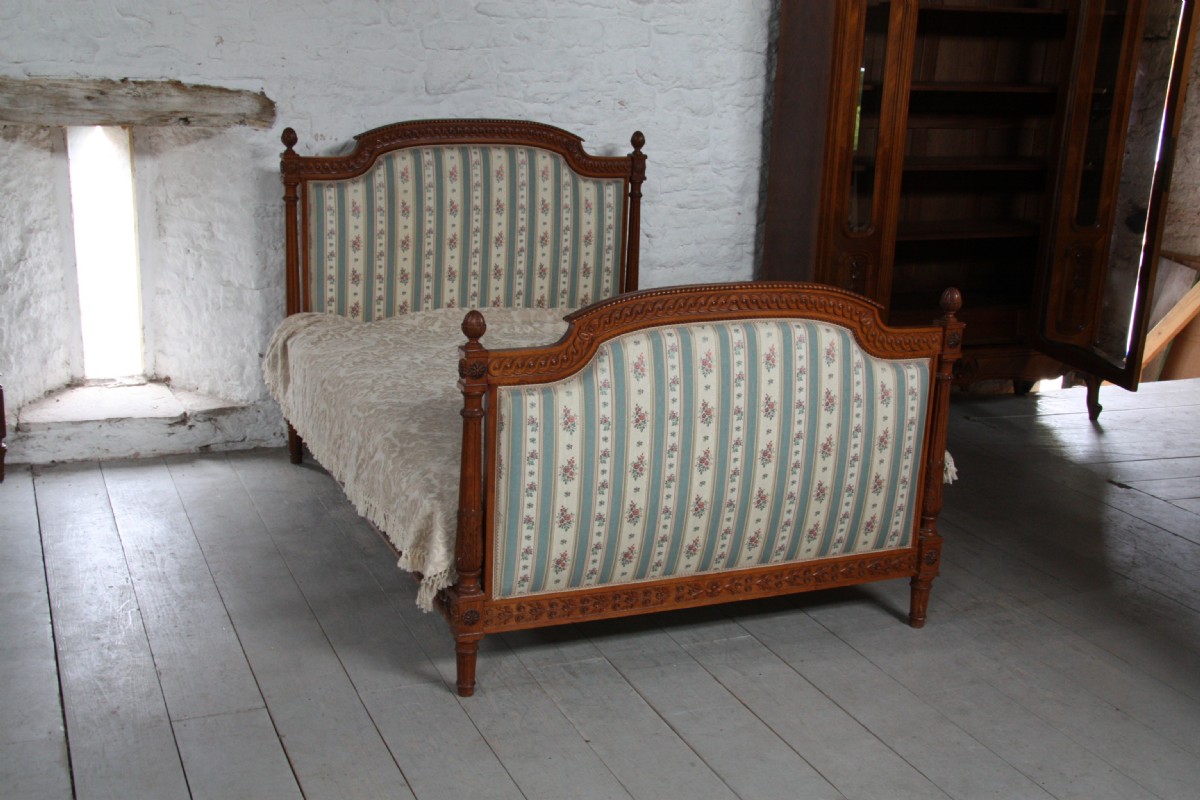 Ornately carved French upholstered Henri 11