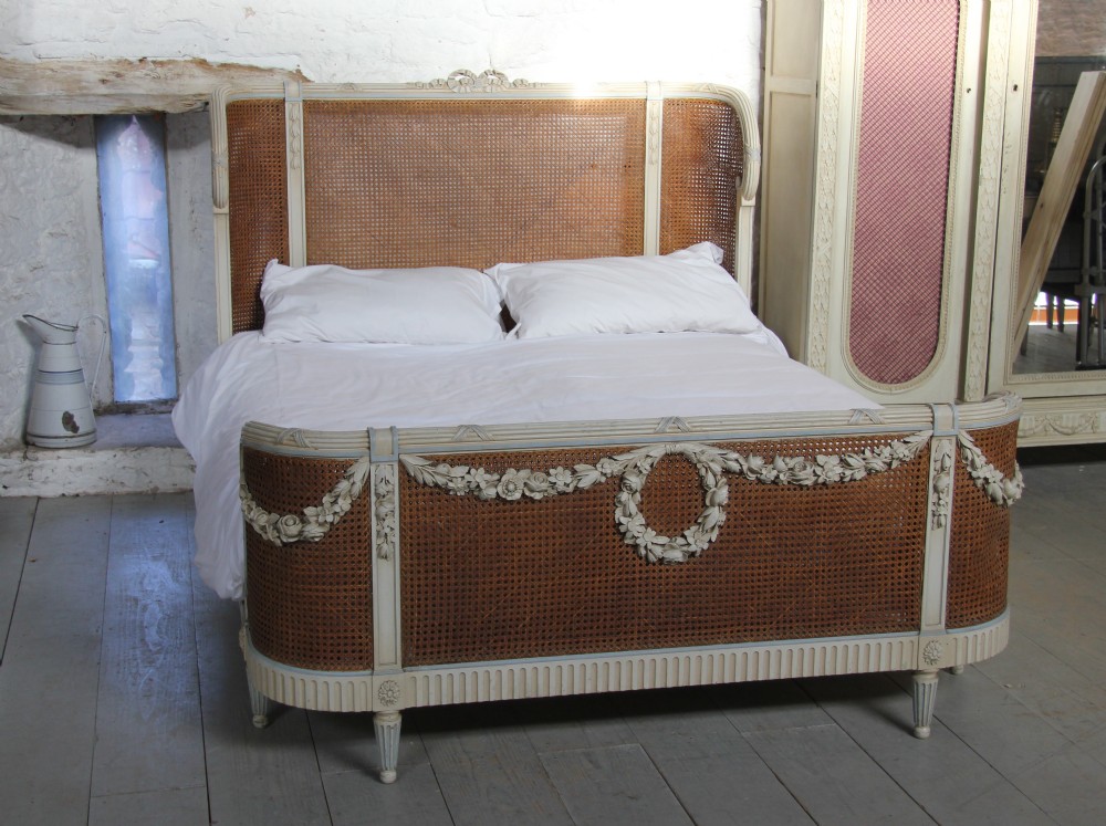 Beautiful and original French painted and caned king size bed