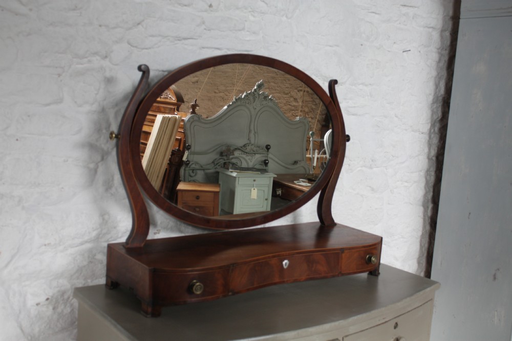 Serpentine front mahogany oval toilet mirror