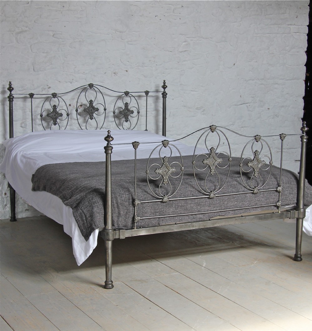 Truly stunning burnished iron king size bed with taper tube posts