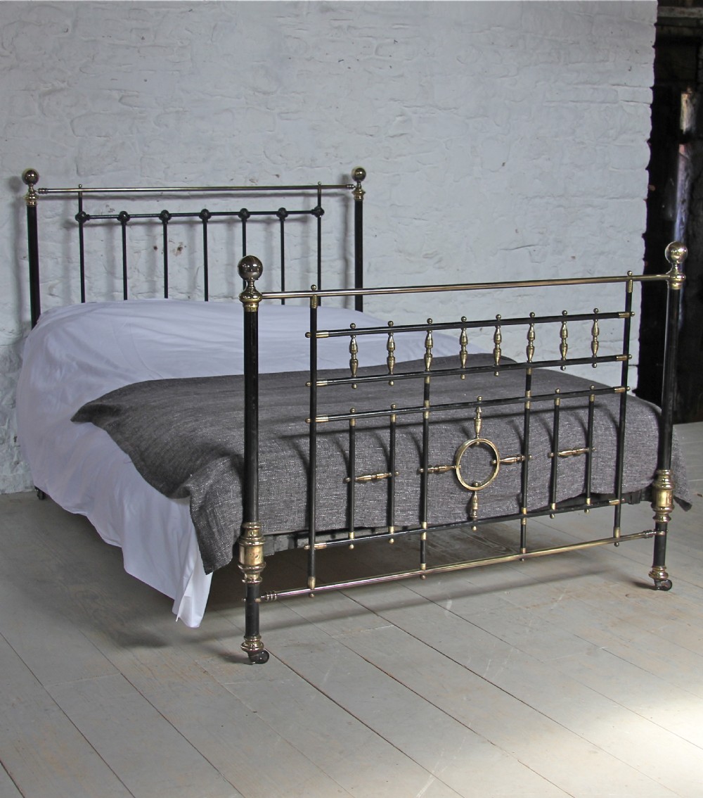 Handsome Victorian black and brass king size bed