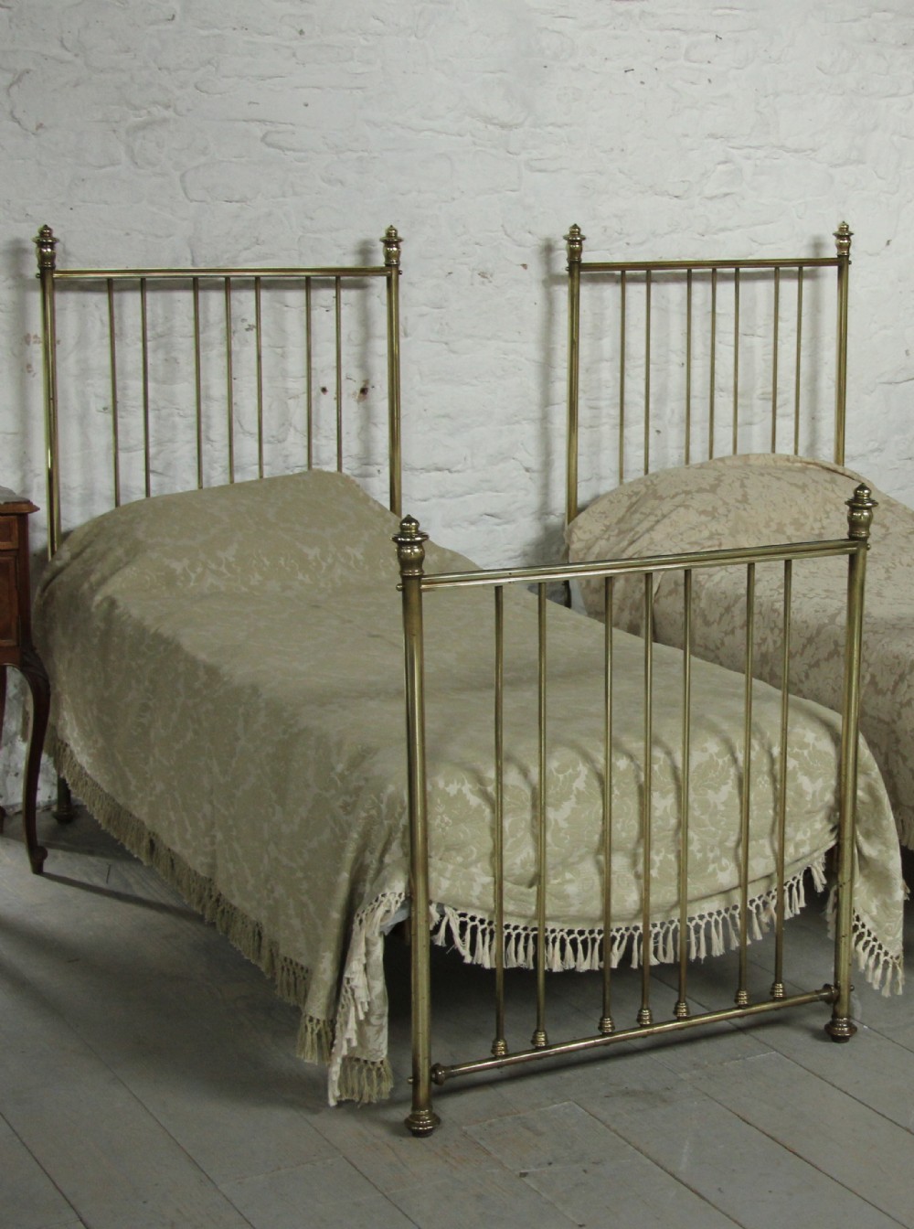 Pair of single Edwardian all brass beds