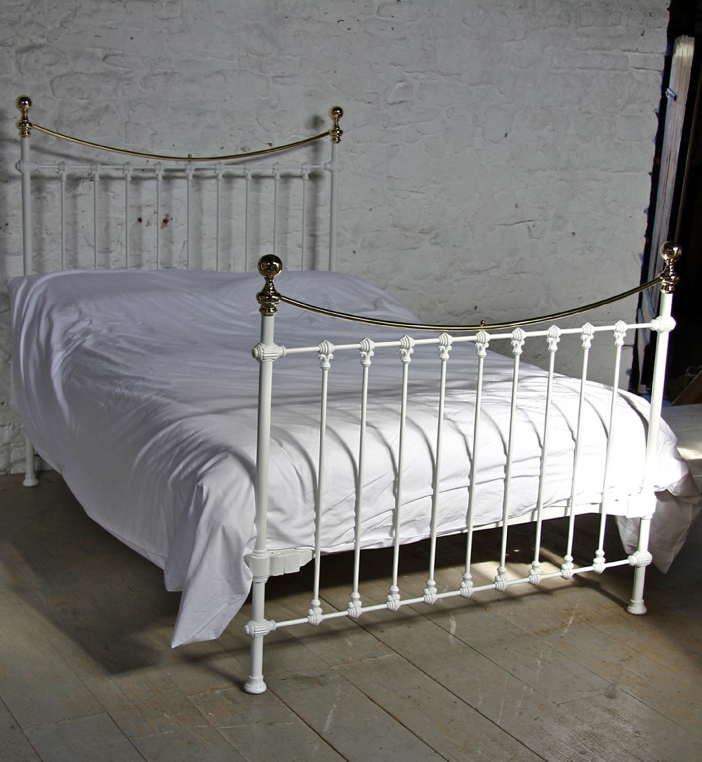 Classic Victorian white and brass dip rail double bed